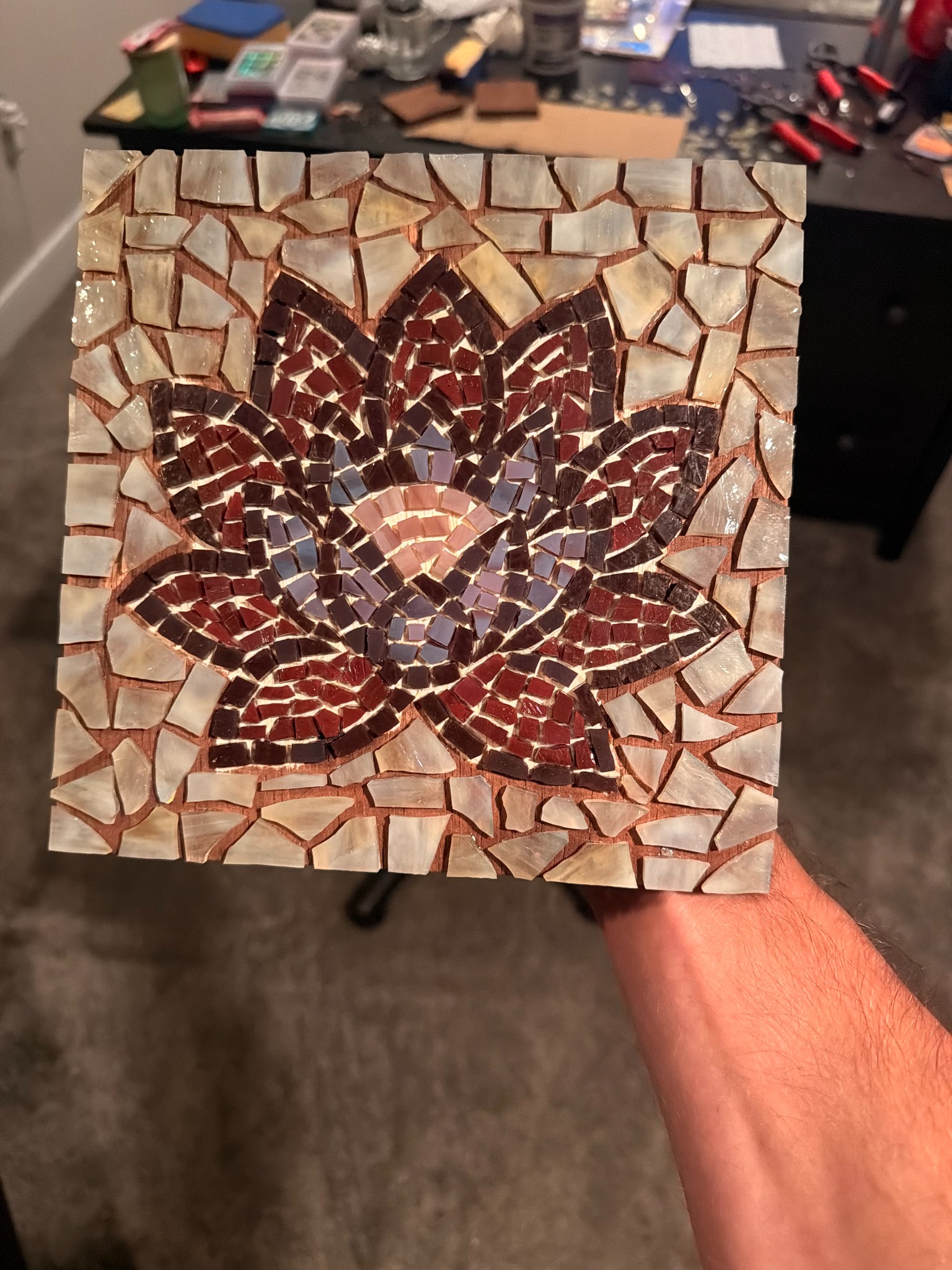 The lotus glass mosaic held in hand before grouting